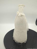 Front view of white Barbie bridal gown on stand