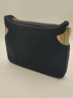 Full view of bag showing velvet exterior, gold-tone corners and chain