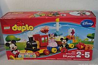 Front of sealed LEGO Duplo Mickey Mouse Birthday Parade box showing set details