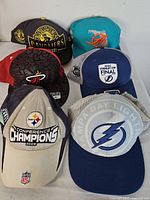 All six sports caps laid out for overview