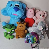 Group shot of seven plush toys