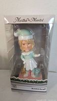 Front of boxed Martha on the Mantel bobblehead