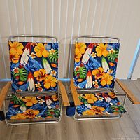 Front view of both Rio beach chairs showing pattern, frames, and armrests