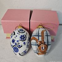 Both Li Bien ornaments front view with boxes