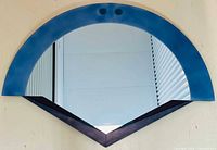 Front view showing full mirror design: blue arch, two teal accents, mirrored glass, burgundy V base