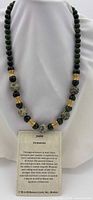 Full view of jade necklace on bust form