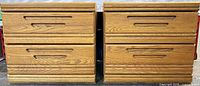 Front view of both nightstands showing drawer fronts and handles