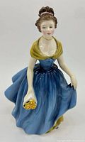 Front view of Royal Doulton Melanie figurine showing dress and roses