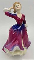 Front view of Royal Doulton Melissa figurine showing pose and colours