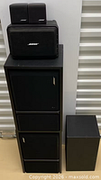 Stack showing VS100, two cube satellites on top of larger speakers