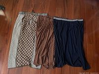 Three skirts side by side showing patterns and colours