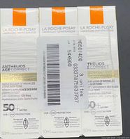 Front view of three La Roche-Posay Anthelios Age Correct SPF 50 cream boxes with barcode label