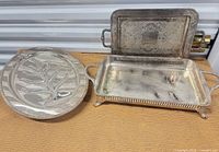 Three silver-plated trays grouped to show shapes and size comparison