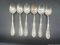 Front view of six matching .800 silver teaspoons