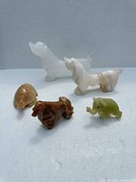 Group shot of all five stone animal figurines