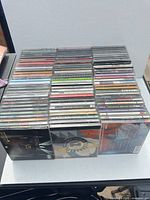 Front view of four stacks of CD jewel cases
