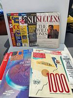 Group shot of all 16 magazines standing and lying down