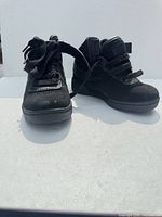 Pair of black Fila toddler high-tops front view
