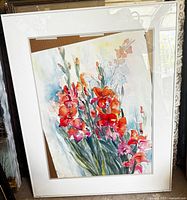 Full view of framed floral watercolour painting showing frame and mat