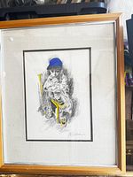 Framed lithograph showing full artwork and frame