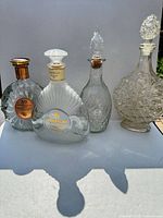 Group shot of four bottles/decanters