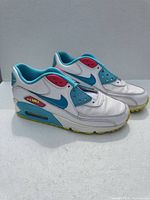 Side view of both sneakers showing colorway and visible Air unit