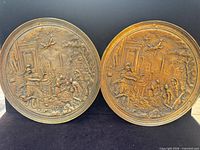 Both bronze plaques front view