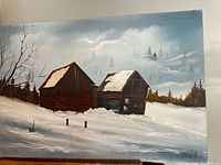 Front view of signed winter landscape painting depicting barns in snow