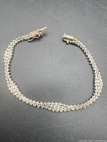 Full view of sterling silver chevron bracelet laid flat