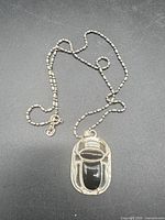 Full view of necklace showing chain and pendant
