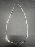 Full view of sterling silver snake chain laid flat