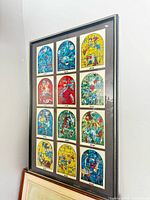Full view of framed poster with 12 window images