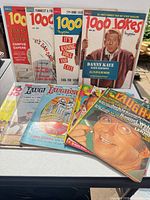 All magazines spread on table showing variety of titles