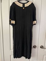 Front view showing collar, cuffs, overall length