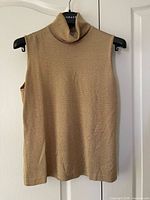 front view of metallic gold Jaeger sleeveless knit top on hanger