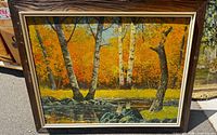 Front view of framed autumn landscape painting