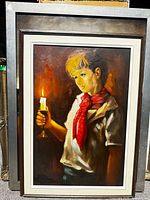 Full view of framed painting showing boy with candle