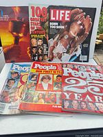 All six magazines laid out front and back row