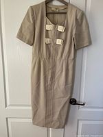 Front view of Valentino Miss V sheath dress on hanger