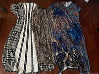 All three dresses laid out showing front patterns