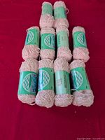 Top view of 11 Catalina yarn skeins with bands visible