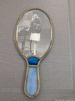 Front view showing photographic portrait under glass and overall shape