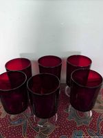 Front view of five of the ruby red goblets showing bowl color and form