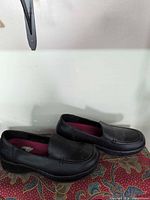 Side view of both shoes showing uppers and overall condition