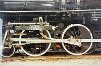Front view of entire photograph showing locomotive wheel detail