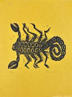 Close view of scorpion image on yellow paper