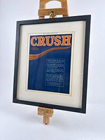 Front view of framed Lemon Crush advertising lithograph showing artwork, matting and frame