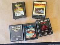 Top view of all five Atari 2600 cartridges laid out