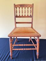 front view of antique spindle-back chair