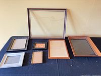 overview of six assorted frames on table